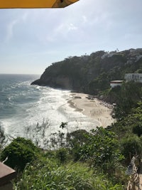 a view of a beach and ocean from a restaurant