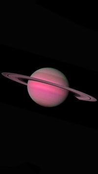 saturn is shown with a pink ring around it